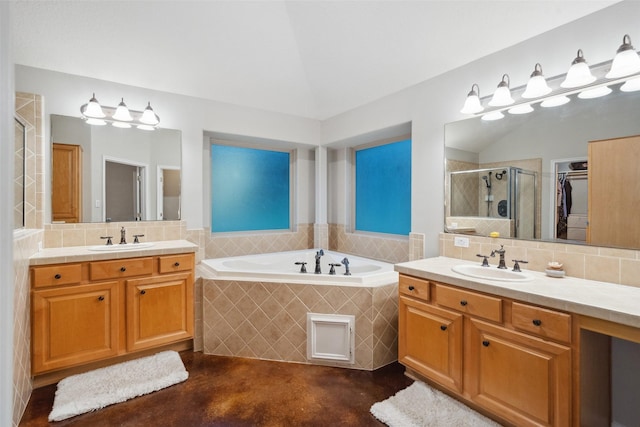 309 County Road 3665 E, Splendora, TX 77372 - full bathroom with a shower stall, lofted ceiling, a bath, two vanities, and decorative backsplash