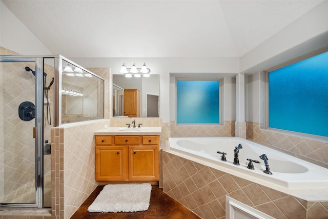 309 County Road 3665 E, Splendora, TX 77372 - full bathroom with a stall shower, a garden tub, and vanity