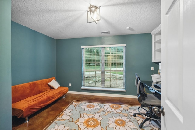 309 County Road 3665 E, Splendora, TX 77372 - office featuring a textured ceiling, baseboards, and concrete flooring