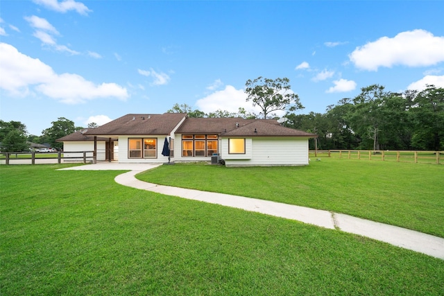 309 County Road 3665 E, Splendora, TX 77372 - back of house featuring a garage and a patio area