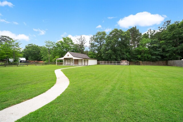 309 County Road 3665 E, Splendora, TX 77372 - view of yard featuring a detached garage