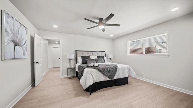9210 Linkmeadow Ln, Houston, TX 77025 - bedroom with light wood finished floors, baseboards, recessed lighting, and ceiling fan