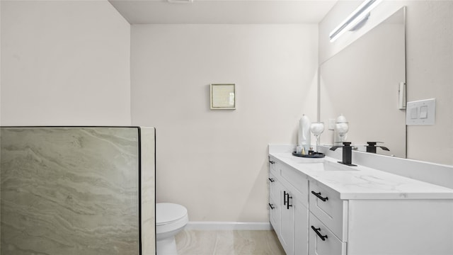 9210 Linkmeadow Ln, Houston, TX 77025 - bathroom featuring marble finish floors, vanity, toilet, and baseboards