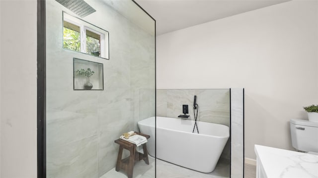 9210 Linkmeadow Ln, Houston, TX 77025 - full bath featuring a freestanding bath, toilet, and tile walls