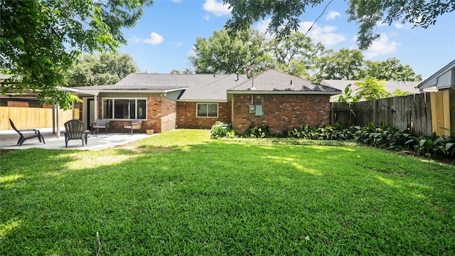 9210 Linkmeadow Ln, Houston, TX 77025 - rear view of property featuring a patio area, brick siding, and a shingled roof