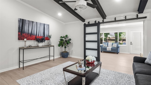 9210 Linkmeadow Ln, Houston, TX 77025 - living room with wood finished floors, ceiling fan, a barn door, baseboards, and recessed lighting