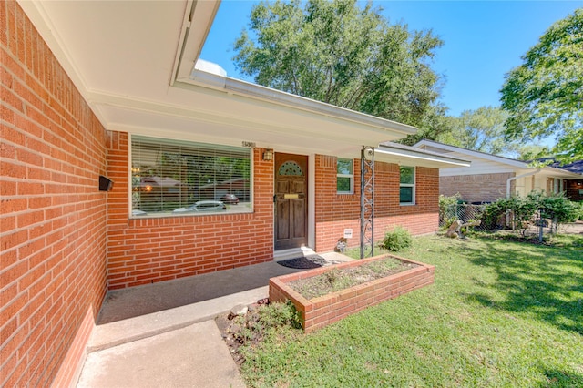 4538 Warm Springs Rd, Houston, TX 77035 - entrance to property featuring brick siding, a lawn, and a porch