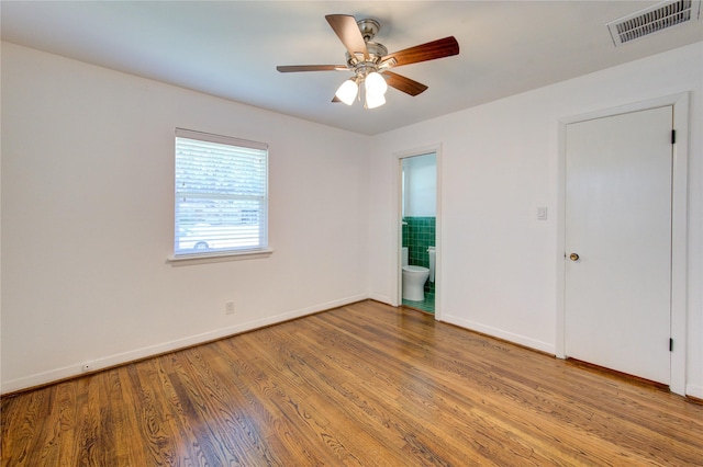 4538 Warm Springs Rd, Houston, TX 77035 - spare room featuring wood finished floors, baseboards, and a ceiling fan