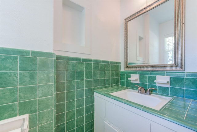 4538 Warm Springs Rd, Houston, TX 77035 - bathroom featuring tile walls, vanity, and wainscoting
