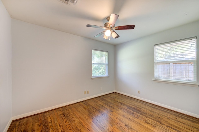 4538 Warm Springs Rd, Houston, TX 77035 - unfurnished room with baseboards, wood finished floors, and a ceiling fan
