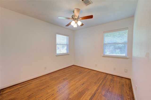 4538 Warm Springs Rd, Houston, TX 77035 - spare room featuring wood finished floors, baseboards, and a ceiling fan