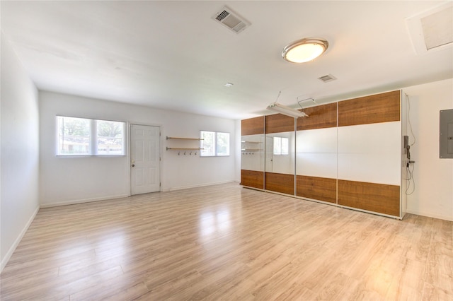 4538 Warm Springs Rd, Houston, TX 77035 - unfurnished room with light wood-style floors, electric panel, and baseboards