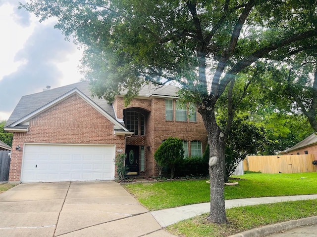 110 Chandler Ct, Sugar Land, TX 77479 - view of front of home with brick siding, an attached garage, and concrete driveway
