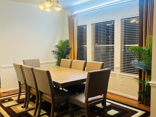 110 Chandler Ct, Sugar Land, TX 77479 - dining space with wood finished floors, baseboards, and a chandelier
