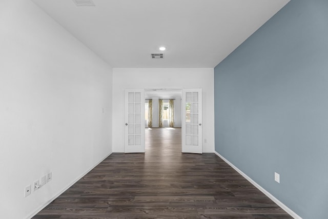 9639 Sterling Arbor Dr, Baytown, TX 77521 - empty room featuring french doors, dark wood-style floors, recessed lighting, and baseboards