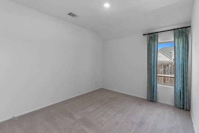 9639 Sterling Arbor Dr, Baytown, TX 77521 - spare room with carpet flooring, lofted ceiling, and baseboards