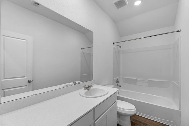 9639 Sterling Arbor Dr, Baytown, TX 77521 - full bathroom with toilet, bathtub / shower combination, wood finished floors, vanity, and lofted ceiling