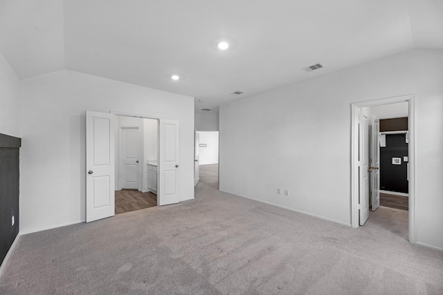 9639 Sterling Arbor Dr, Baytown, TX 77521 - unfurnished bedroom featuring vaulted ceiling, carpet floors, baseboards, recessed lighting, and connected bathroom