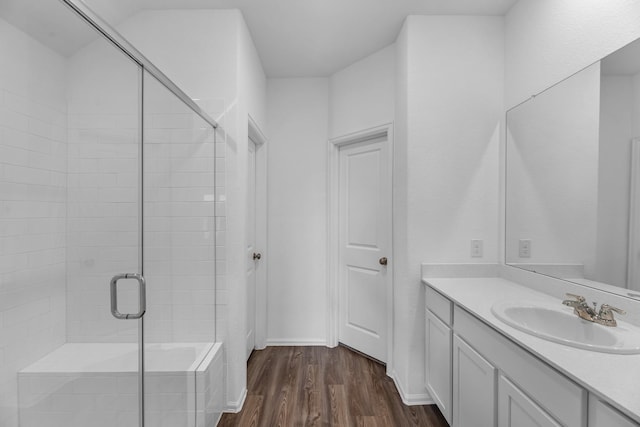9639 Sterling Arbor Dr, Baytown, TX 77521 - bathroom with wood finished floors, a stall shower, and vanity