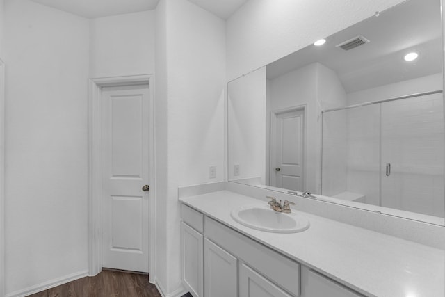 9639 Sterling Arbor Dr, Baytown, TX 77521 - full bath with wood finished floors, vanity, a tile shower, baseboards, and recessed lighting