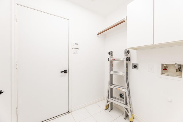 washroom with electric dryer hookup, cabinet space, baseboards, and washer hookup
