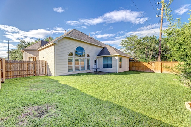 rear view of property with roof with shingles