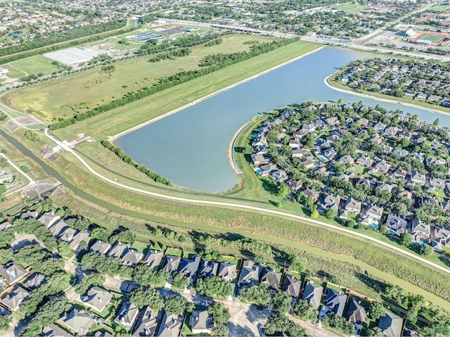 aerial overview of property's location featuring a nearby body of water and nearby suburban area