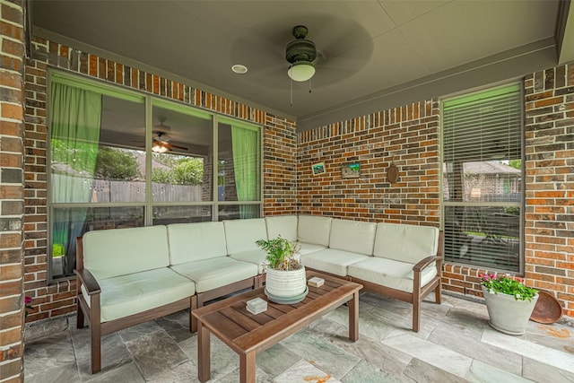 view of patio featuring a ceiling fan and an outdoor living space