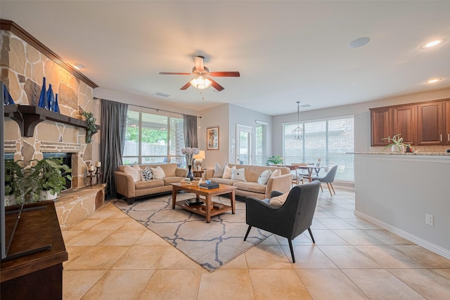 living room featuring healthy amount of natural light, ceiling fan, baseboards, light tile patterned floors, and recessed lighting
