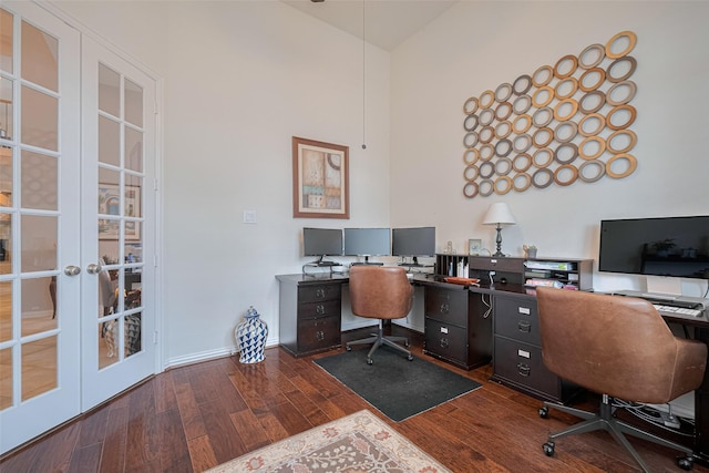 office space featuring french doors, wood finished floors, high vaulted ceiling, and baseboards