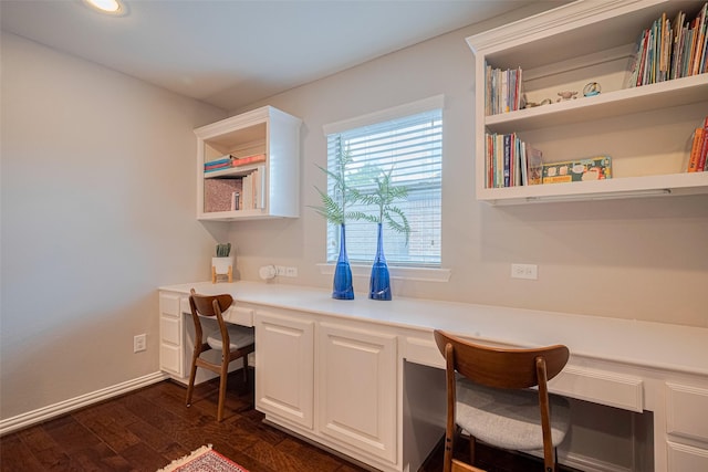 office with built in desk, dark wood-style flooring, recessed lighting, and baseboards