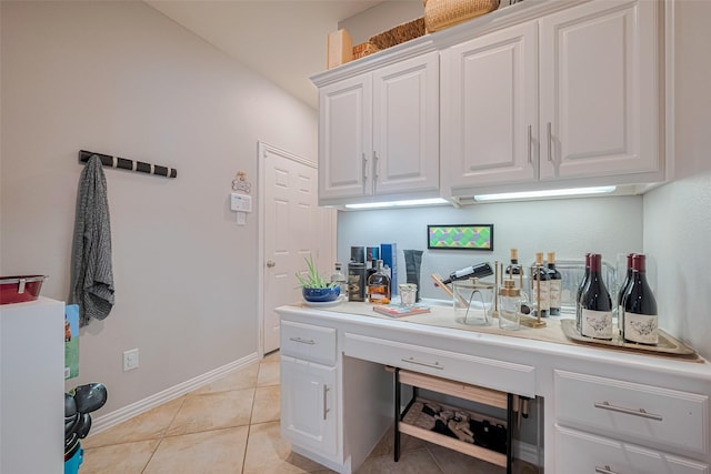 office with light tile patterned floors and baseboards