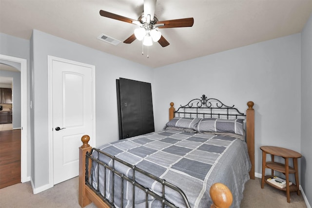 bedroom with carpet flooring, baseboards, and ceiling fan
