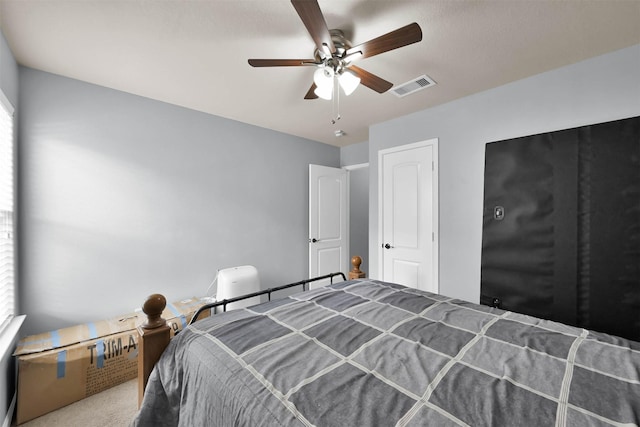 carpeted bedroom featuring ceiling fan