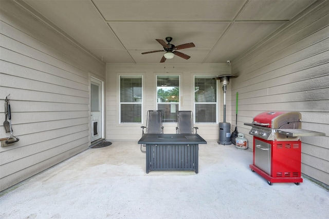 view of patio featuring ceiling fan and a grill