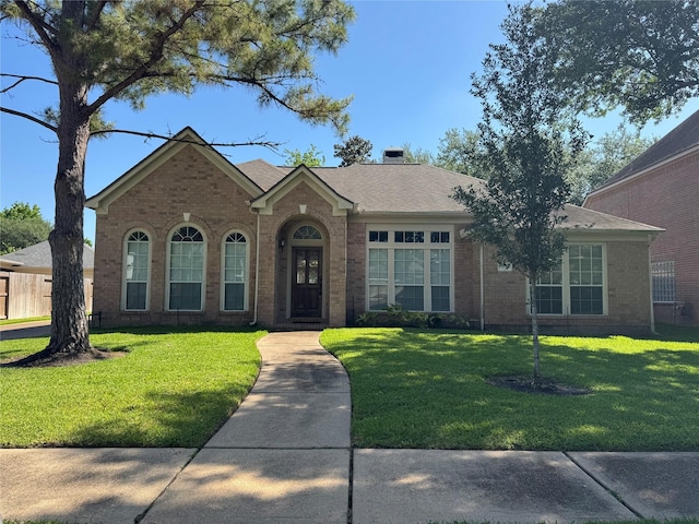 3615 Huggins Way St, Pearland, TX 77584 - view of front of home with brick siding and a front lawn