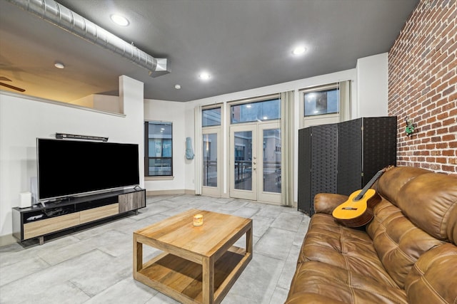 living room featuring french doors and recessed lighting
