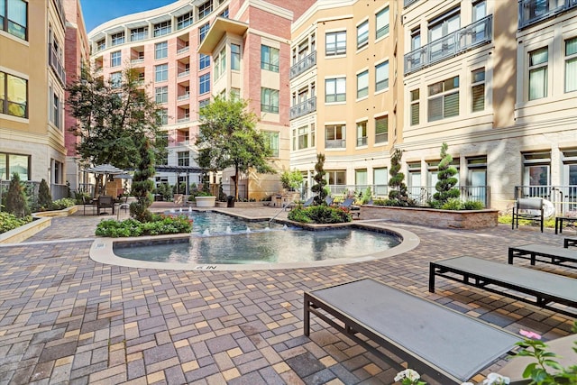 view of home's community with a patio area and fence