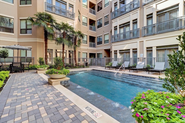 community pool featuring fence