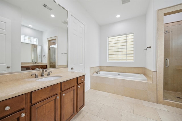 2813 Clinton Dr, Houston, TX 77020 - bathroom featuring a shower stall, a bath, tile patterned floors, vanity, and recessed lighting