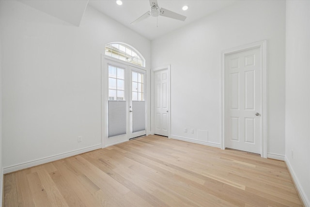 2813 Clinton Dr, Houston, TX 77020 - empty room featuring light wood-style floors, a ceiling fan, baseboards, recessed lighting, and high vaulted ceiling