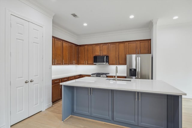 2813 Clinton Dr, Houston, TX 77020 - kitchen featuring stainless steel appliances, a sink, light wood finished floors, ornamental molding, and light countertops