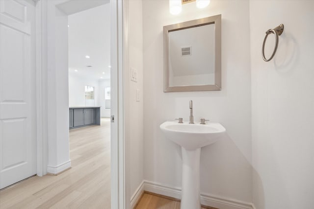 2813 Clinton Dr, Houston, TX 77020 - bathroom with wood finished floors and baseboards