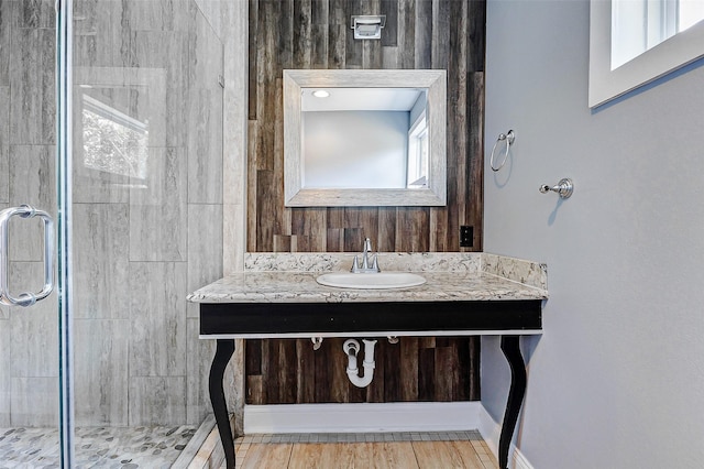 bathroom featuring a stall shower, healthy amount of natural light, and vanity