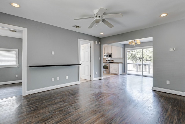 unfurnished living room with a chandelier, baseboards, dark wood finished floors, a ceiling fan, and recessed lighting
