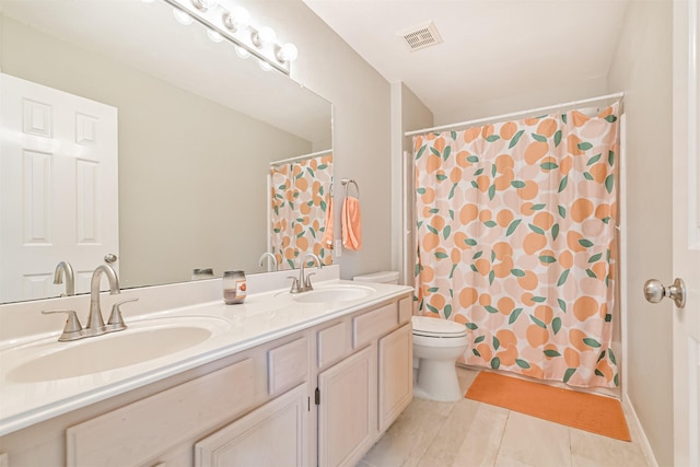 bathroom featuring toilet, tile patterned flooring, double vanity, and a shower with shower curtain