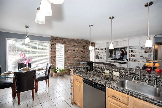 2101 Fountain View Dr Unit 80, Houston, TX 77057 - kitchen with dishwasher, a sink, light brown cabinets, brick wall, and dark countertops