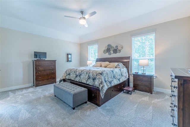 carpeted bedroom with baseboards and ceiling fan