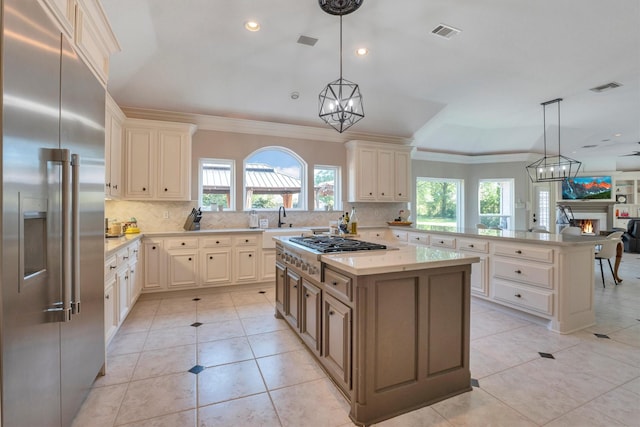 12710 Everhart Pointe Dr, Tomball, TX 77377 - kitchen featuring stainless steel appliances, healthy amount of natural light, decorative backsplash, ornamental molding, and recessed lighting