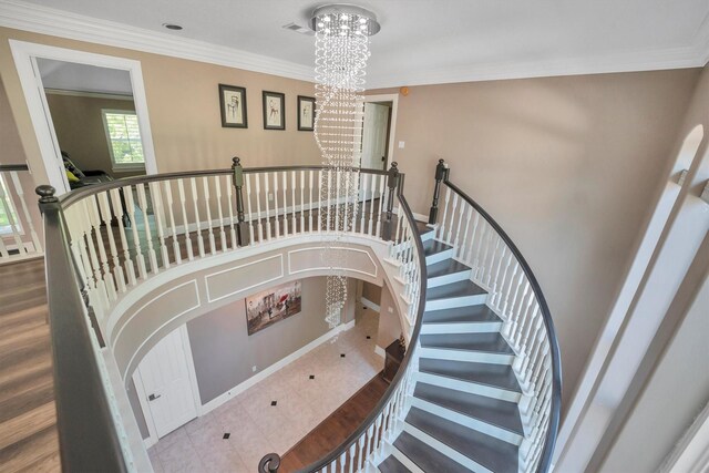 12710 Everhart Pointe Dr, Tomball, TX 77377 - staircase featuring a chandelier, crown molding, and baseboards